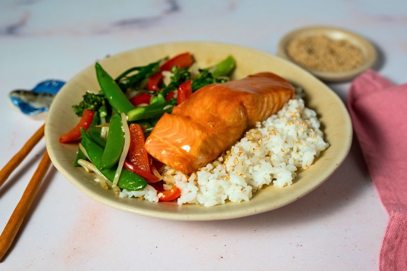 teriyaki salmon dish in plate with rice